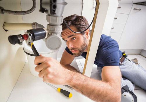 plumber fixing pipes image - Wellington Plumbers